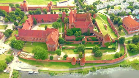 Aerial-view-of-Castle-of-the-Teutonic-Order-in-Malbork,-Malbork-,-largest-by-land-in-the-world,-UNESCO-World-Heritage-Site,-Poland