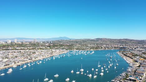 An-aerial-view-of-stunning-Newport-harbor-on-a-sunny-day-full-of-luxury-boats