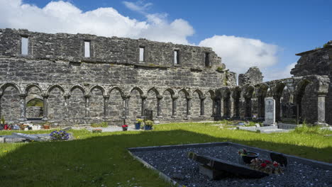 Motion-time-lapse-of-Creevelea-Abbey-medieval-ruin-in-county-Leitrim-in-Ireland-as-a-historical-sightseeing-landmark-and-graveyard-with-dramatic-clouds-in-the-sky-on-a-summer-day