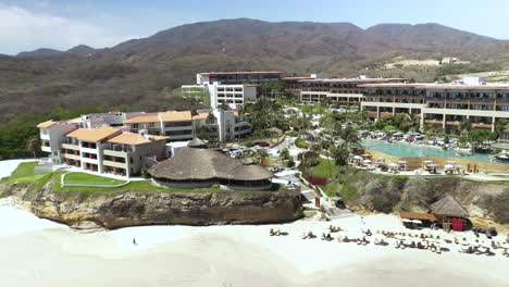 Tropical-Resort-Hotel-on-the-Beach-of-Puerto-Vallarta,-Mexico---Aerial