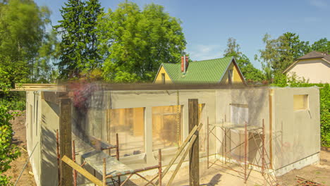 Time-lapse-shot-showing-group-of-worker-build-new-wooden-house-during-sunny-day-outdoors