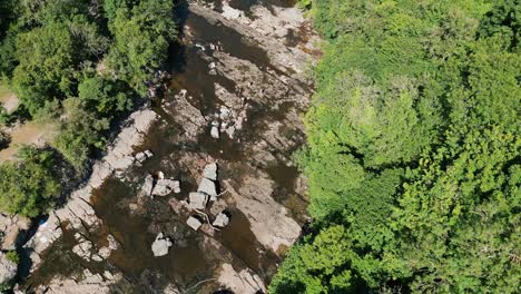 Ariel-drone-down-view-of-Aysgarth-Falls-The-three-stepped-waterfalls-at-Aysgarth-have-been-a-tourist-attraction-for-over-200-years