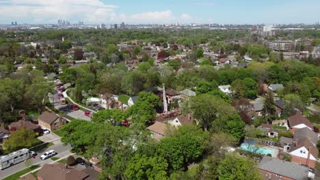 aerial-drone-pushes-in-on-house-fire-in-Toronto,-Canada