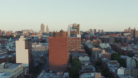 Stationary-aerial-shot-down-Harlem-streets-just-after-sunrise