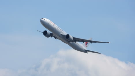 China-Eastern-Boeing-B777-taking-off-cotton-ball-clouds