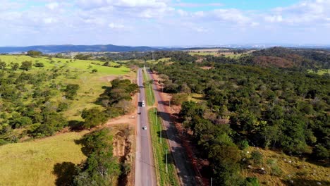 A-scenic-highway-through-the-countryside---pull-back-aerial-view