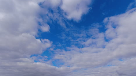 Cloud-drifts-slowly-in-blue-sky,-making-natural-dynamic-background