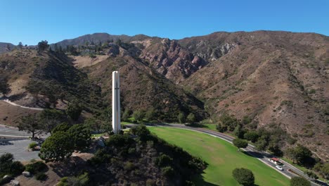 The-Phillips-Theme-Tower-at-Pepperdine-University-with-the-surrounding-mountains-and-canyons-in-the-background---aerial-flyover