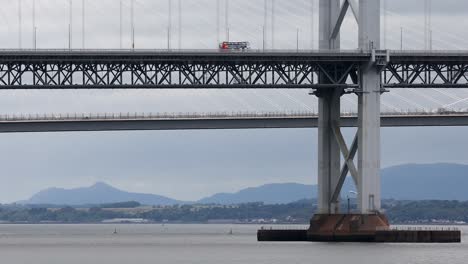 Bus-and-rush-hour-traffic-crossing-Queensferry-and-Forth-road-bridge,-close-up