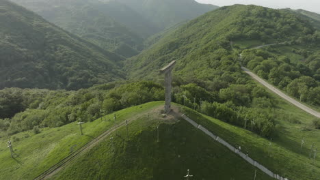 Arc-aerial-shot-of-a-monument-in-the-Didgori-Valley-located-in-Georgia
