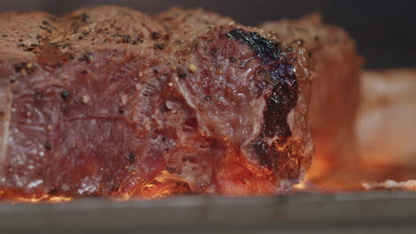 Close-Up-Seasoned-Beef-Steak-Cooking-In-Flame-Grill-Barbecue-In-Slow-Motion,-4K