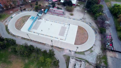 Aerial-view-of-several-people-skating-on-a-smooth-white-rink