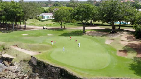 Aerial-View-Of-Golf-Course-With-Players---Golf-Tournament-At-Casa-De-Campo-In-La-Romana,-Dominican-Republic---drone-shot
