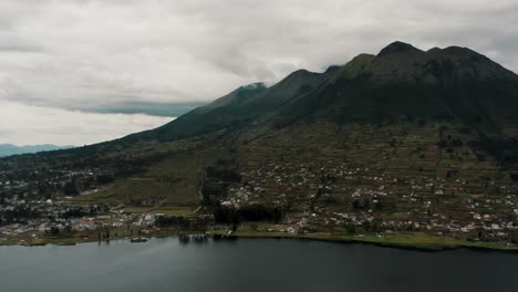 Idyllic-Village-Of-San-Pablo-Del-Lago-By-The-Lakeshore-With-Imbabura-Volcano-At-Background-Near-Otavalo-In-Ecuador