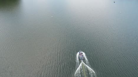 Speedboat-on-lake.-Drone-capture-accompanying-boat
