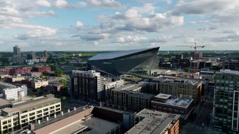 slow-push-in-aerial-drone-shot-of-The-Viking's-US-Bank-stadium-in-downtown-Minneapolis-Minnesota