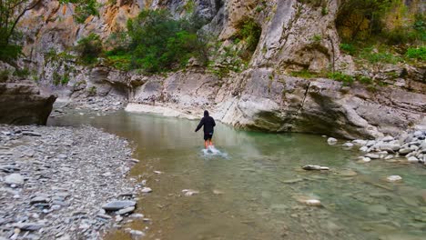 A-man-walking-in-Lengarica-Canyon
