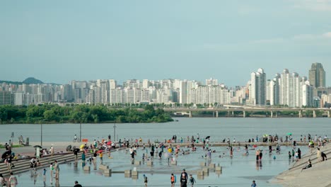Korean-families-with-children-have-fun-at-shallow-pools-of-Yeouido-Hangang-Park-Cascade-Plaza-by-Han-river