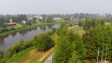4K-Drone-Video-of-the-Chena-River-running-through-Downtown-Fairbanks,-Alaska-during-Summer-Day