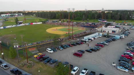 4K-Drone-Video-of-Parking-Lot-at-Growden-Memorial-Field-during-the-Midnight-Sun-Classic-Baseball-Game-in-Fairbanks,-Alaska-on-the-longest-day-of-Summer