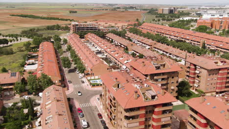 Modern-Spanish-living-district-on-hot-sunny-day,-aerial-view