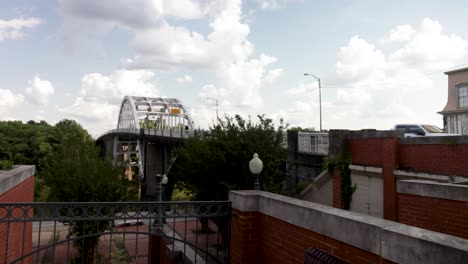 Edmund-Pettus-bridge-in-Selma,-Alabama-with-gimbal-video-walking-forward-in-plaza-with-slow-motion