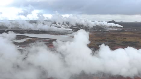 Aerial-shot-flying-through-the-steam-of-a-geothermal-power-station
