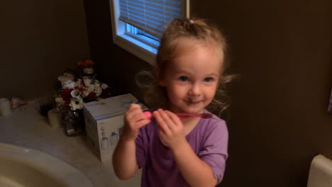 Little-girl-brushing-teeth-before-bed
