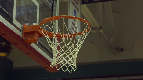 basketballs-are-shot-at-hoop-during-practice-from-a-low-angle-closeup