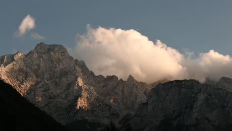 Time-lapse-clouds-over-mountain-peak-in-sunset,-Ojstrica-in-Kamnisko-Savinjske-Alpe,-Slovenia,-Logarska-dolina,-European-Alps