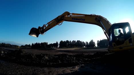 Yellow-Excavator-Works-with-Bucket-to-Clear-Mud-Sludge-and-Debris-from-the-bottom-of-the-Drained-River