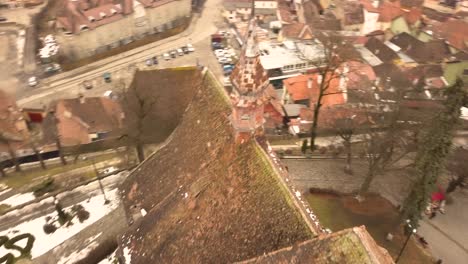 A-drone-shot,-with-rotating-motion,-capturing-a-glimpse-of-the-city-of-Sighisoara-on-an-afternoon