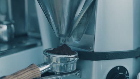 Coffee-Barista-Machine-grinding-coffee-beans