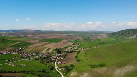 Aerial-view-of-farmland-and-terrain-near-Transylvania,-Romania