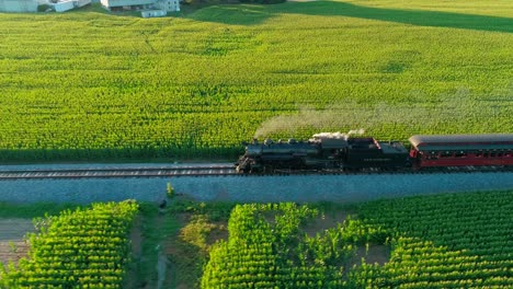 Steam-Train-Puffing-along-in-Amish-Countryside-as-seen-by-Drone