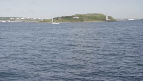 Sail-boat-passing-a-island