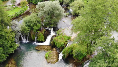 Aerial-drone-shot-of-nature-and-waterfalls-in-Rastoke,-near-the-town-of-Slunj,-Croatia