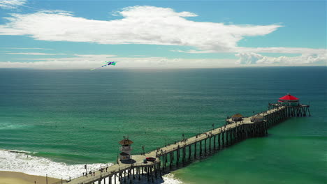 Drone-footage-of-a-kite-flying-over-the-Huntington-Beach-pier