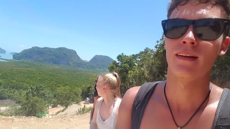 Three-travellers-hiking-up-a-small-mountain-As-you-can-see-its-a-pretty-clear-and-hot-day-for-the-Travellers