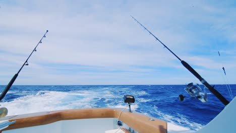 Fishing-poles-trolling-for-big-game-on-yacht-in-Caribbean-Sea