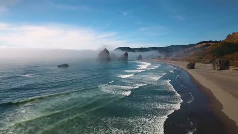 AERIAL:-Push-in-towards-Oregon's-rock-formations-sitting-within-the-Pacific-Ocean