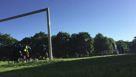 Spectator-POV-of-community-soccer-game-at-Christie-Pitts-in-Toronto,-Canada