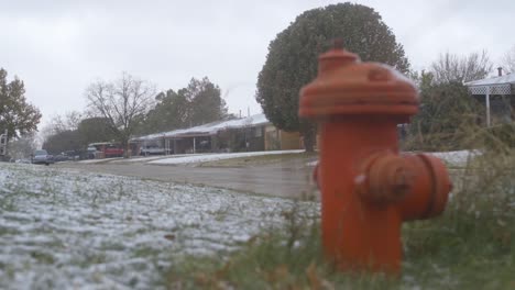 Run-down-neighborhood-fire-hydrant-in-the-snow-in-slow-motion