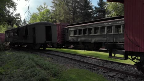Drone-shot-of-old-historic-trains-in-a-tiny-town-in-the-mountains