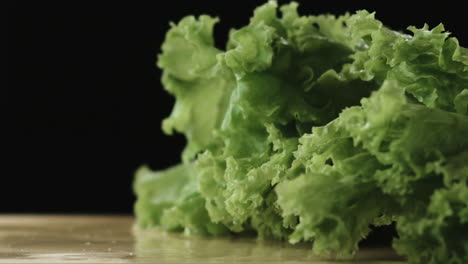 Slow-Motion-of-Lettuce-Dropping-in-Chopping-Board