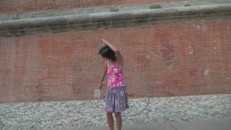 Slow-Motion-Close-up-and-Panning-of-Girl-Doing-Hula-Hoop