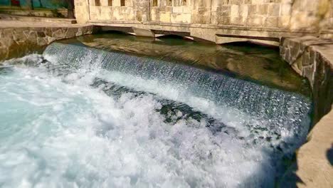 Fast-moving-water-over-a-weir-in-slow-motion-but-reversed-so-water-is-flowing-up-the-weir