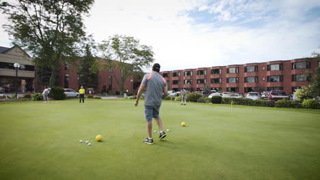 Wide-shot-of-a-group-of-golfers-playing-miniature-golf
