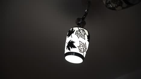 Close-up-shot-of-a-hanging-lamp-with-floral-pattern