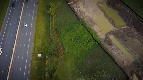 Drone-flying-over-a-highway-in-a-beautiful-rural-countryside